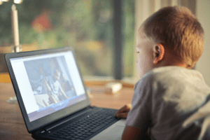 Boy watch laptop